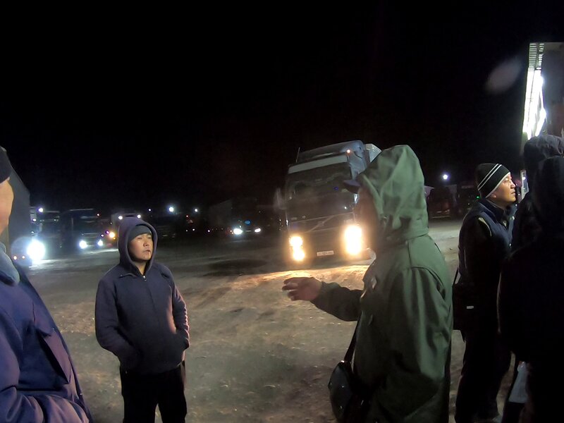 The never-ending job of babysitting this foolish tourist now fell on the kind border officer. Trying to find a truck to Osh.