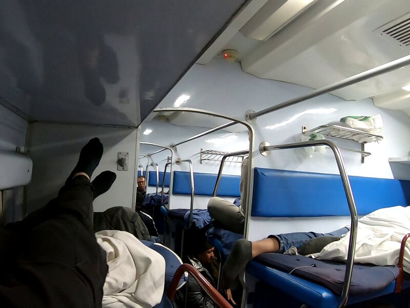 The strong white light jolted the slumbering night train into a half-awakened stupor as it approached Tashkent.