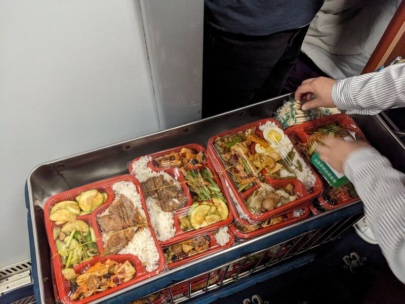 A semi-hot dinner box. And a whole lot of chopsticks!